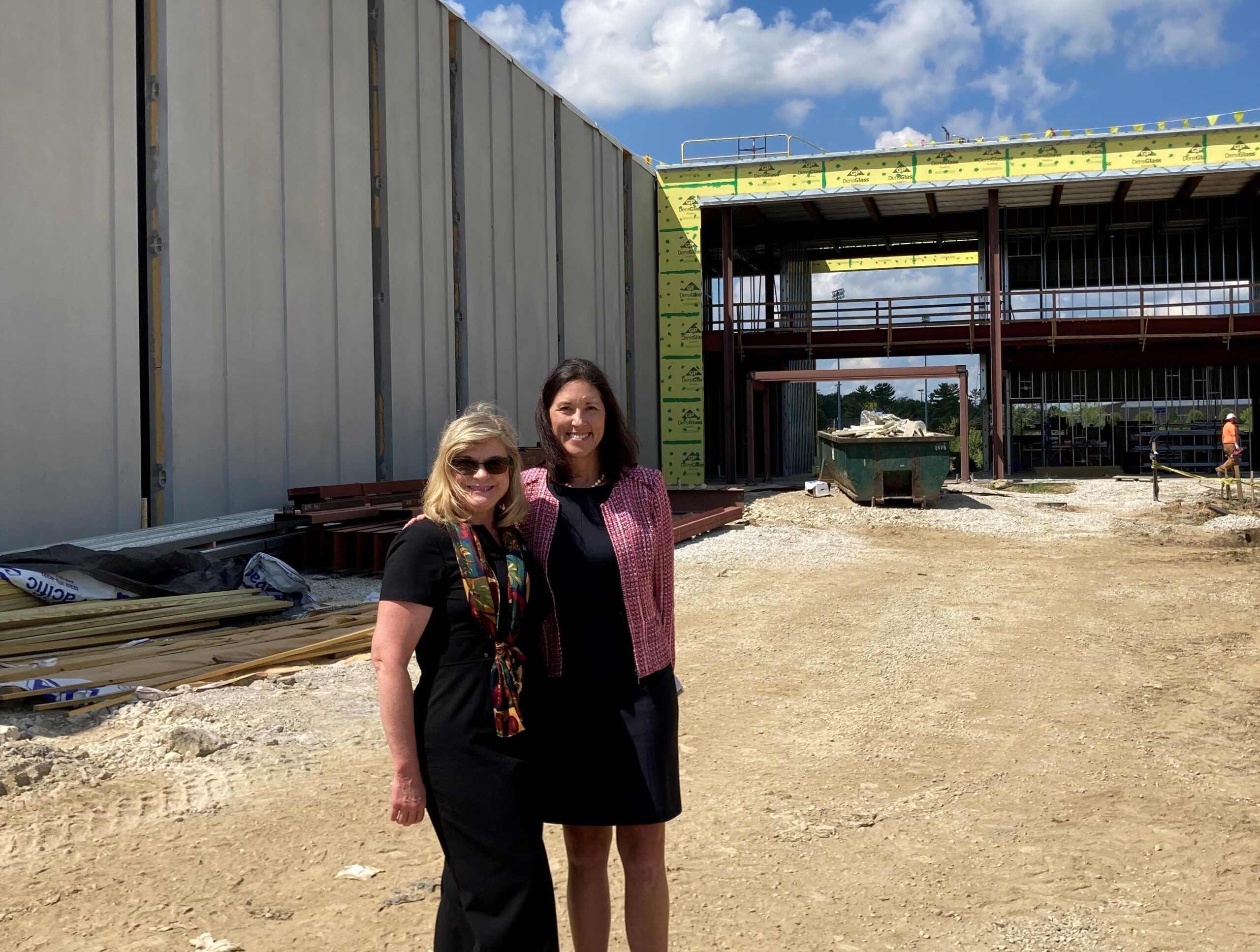 (Susan Brehm and Dr. Quirk-Bailey pictured below in front of the Workforce Sustainability Center.)
